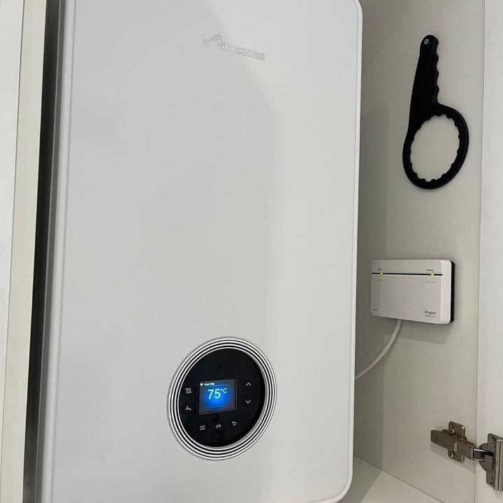 Worcester combi boiler installed in a fitted cupboard